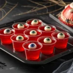 Easy eyeball Jello shots with gummy eyes on a Halloween party tray