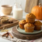 Healthy Greek Yogurt Pumpkin Muffins stacked on a rustic plate