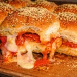 A plate of delicious pizza sliders topped with melted cheese and pepperoni.