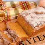 Homemade sweet potato cinnamon bread loaf on a wooden cutting board
